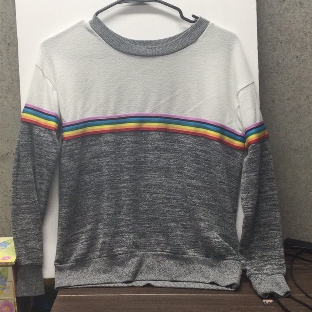 Woman’s small rainbow striped sweater